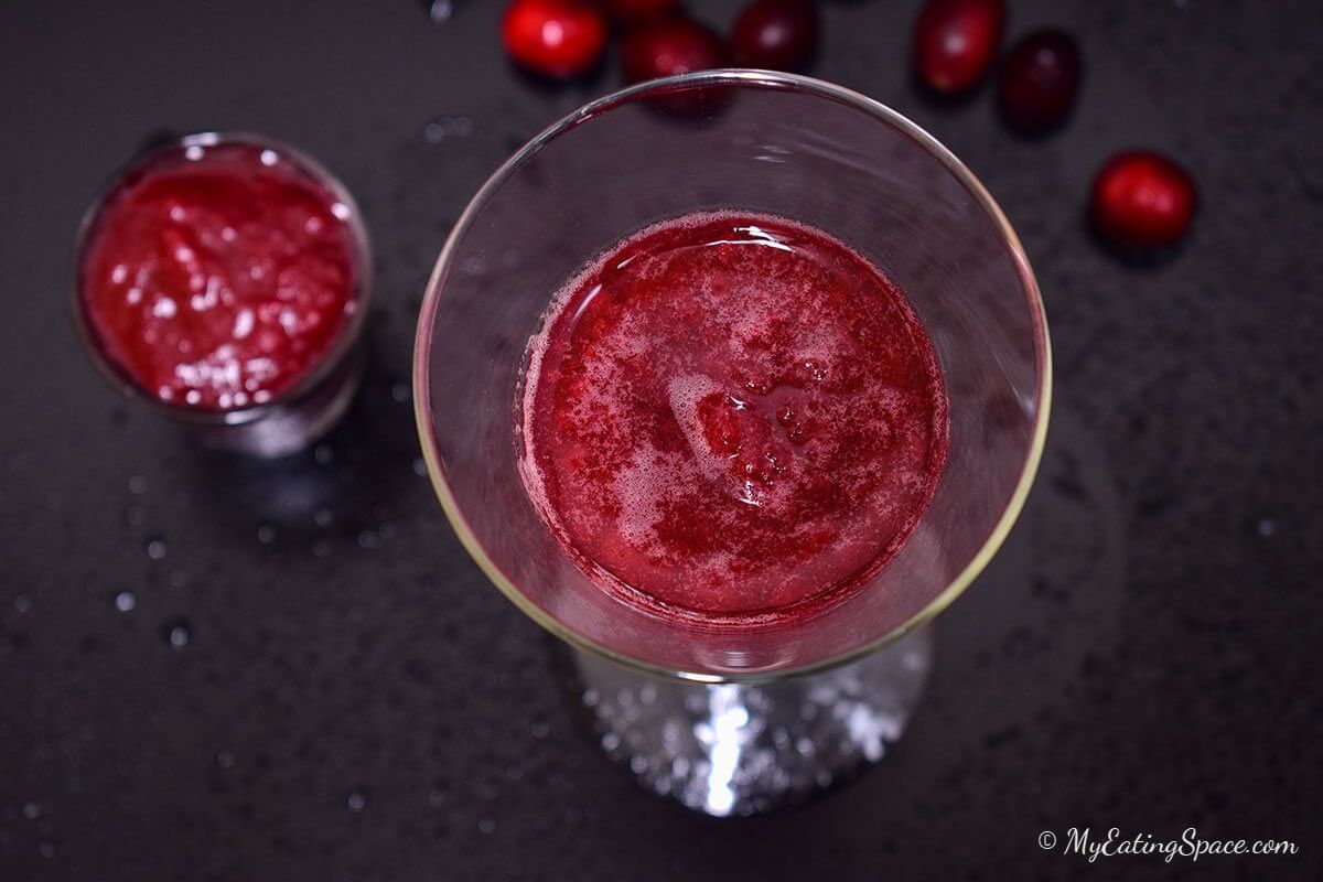 Orange cranberry slush, an instant cool drink made from homemade cranberry sauce. Make the sauce ahead and enjoy a cool slush all year round. More recipes at http://myeatingspace.com/