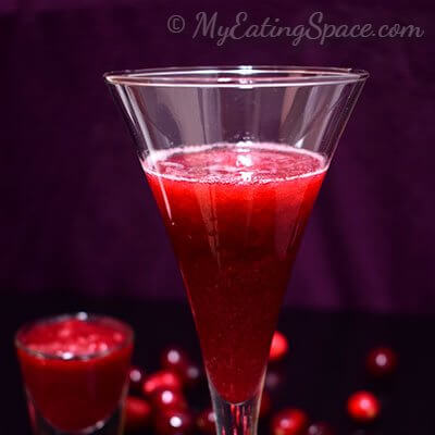 Orange cranberry slush, an instant cool drink made from homemade cranberry sauce. Make the sauce ahead and enjoy a cool slush all year round. More recipes at http://myeatingspace.com/